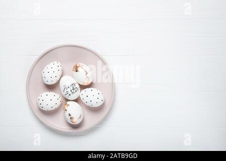 Easter eggs on a pink plate. Place for text Stock Photo