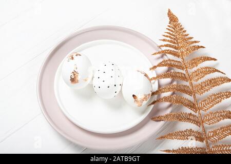 Beautiful easter composition. Easter eggs on a plate Stock Photo