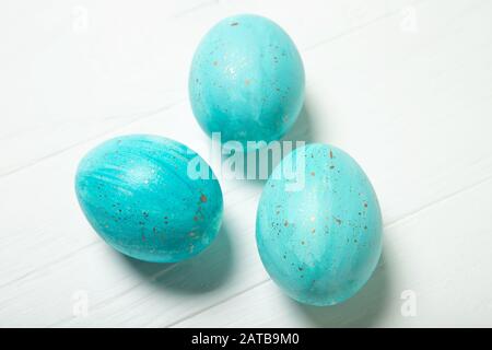 Blue Easter eggs with gold splashes Stock Photo