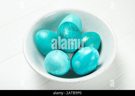 Easter eggs in a plate on a white background Stock Photo