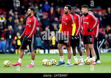 Watford's Andre Gray (left), Troy Deeney and Adam Masina during the pre-match warm up ahead of the Premier League match at Vicarage Road, Watford. Stock Photo