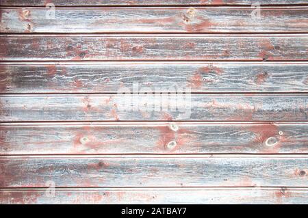 Wooden background. Pink spots on weathered grey wooden planks wall Stock Photo