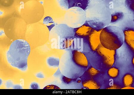 Oil bubbles inside water base form patterns Stock Photo