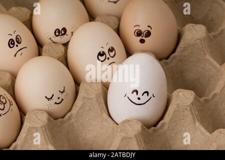 Smiley face on eggs in egg box.Happy easter concept Stock Photo