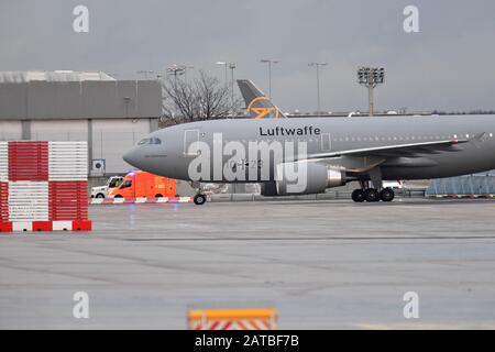 01 February 2020, Hessen, Frankfurt/Main: The Airbus A310 'Kurt Schumacher' of the German Federal Armed Forces and a plane of the Federal Republic of Germany arrive at Frankfurt Airport. The Bundeswehr aircraft has flown Germans and other citizens out of Wuhan, China, which is affected by the coronavirus. Photo: Boris Roessler/dpa Stock Photo