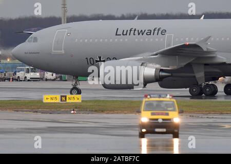 01 February 2020, Hessen, Frankfurt/Main: The Airbus A310 'Kurt Schumacher' of the German Federal Armed Forces and a plane of the Federal Republic of Germany arrive at Frankfurt Airport. The Bundeswehr aircraft has flown Germans and other citizens out of Wuhan, China, which is affected by the coronavirus. Photo: Boris Roessler/dpa Stock Photo