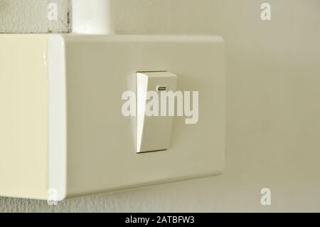 toggle switch in plastic box on the wall Stock Photo