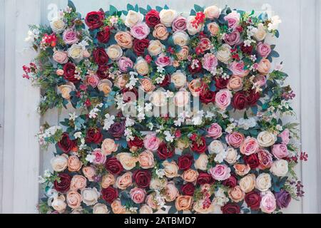 Vintage effect. Many flowers in gentle red and white tones as a background for any your art project. beautiful flower background, colorful nature Stock Photo