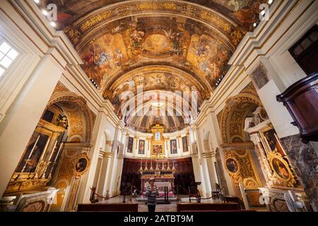 Valletta, Malta - October 10, 2019: Church of Our Lady of Victory interior, high altar and ceiling with frescos Stock Photo