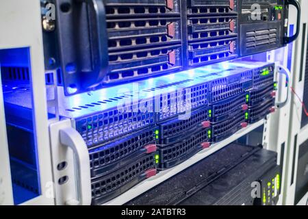 Powerful computer servers are in the rack. The computer equipment is  on the technical site of the Internet provider. The concept of data processing. Stock Photo
