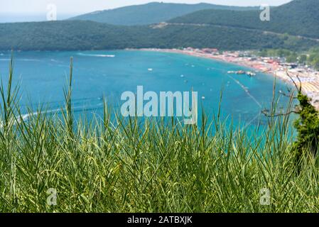 Panoramic view of the largest beach with many people in lagoon in Przno. Adriatic Seacoast, Przno Beach, Milocer, Montenegro Stock Photo