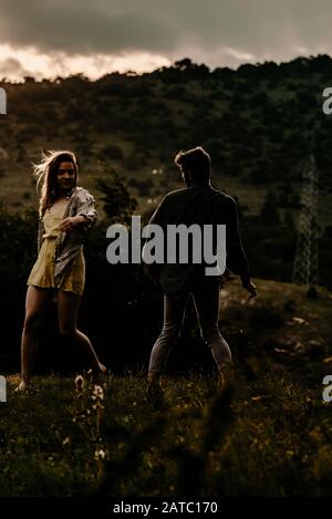 Young beautiful barefoot couple dancer practicing modern dance Stock Photo