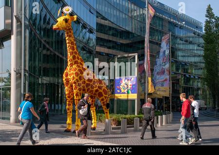 Huge Lego Giraffe behind the Sony Center in Berlin Potsdamer Platz, Germany Stock Photo