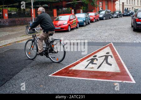 Crosswalk yield sign for children in Kreuzberg district in Berlin Germany Stock Photo