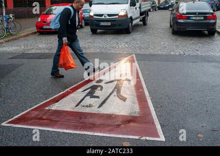 Crosswalk yield sign for children in Kreuzberg district in Berlin Germany Stock Photo