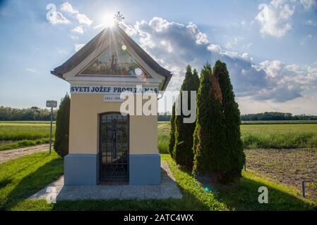 Small chappel in the middle of the fields in slovenia Stock Photo