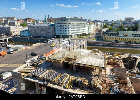 Construction site in Moscow, Russia. Panorama of developing city in summer. View of building under construction from above. Cityscape with modern buil Stock Photo