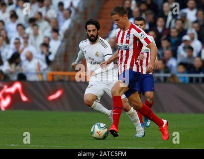 Atletico de Madrid's Marcos LLorente and Real Madrid CF's Isco Alarcon are seen in action during the Spanish La Liga match round 22 between Real Madrid and Atletico de Madrid at Santiago Bernabeu Stadium in Madrid.(Final score; Real Madrid 1-0 Atlético de Madrid) Stock Photo