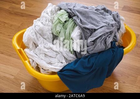 Some freshly washed clothes in a basket. Close up. Stock Photo