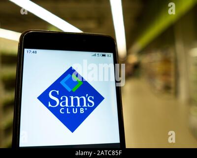 In this photo illustration the Sam’s club logo is seen displayed on a smartphone. Stock Photo
