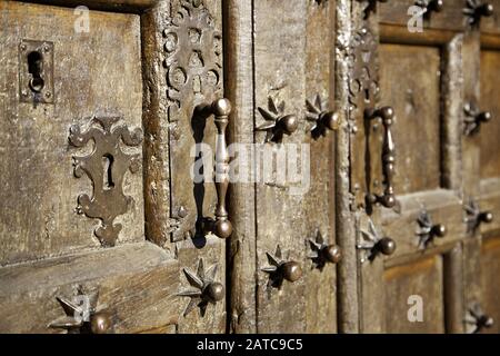 Wooden door with ancient lock, construction and architecture Stock Photo