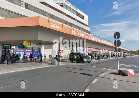 BERLIN, GERMANY - OCTOBER 18, 2019: People visit Tegel Otto Lilienthal airport. It is the main international airport of Berlin, the federal capital of Stock Photo