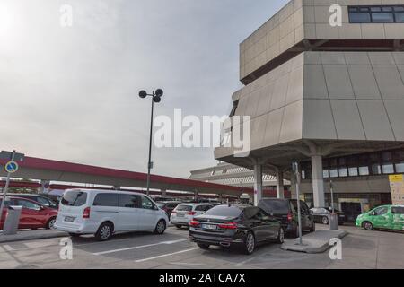 BERLIN, GERMANY - OCTOBER 18, 2019: Cars parked in front of Tegel Otto Lilienthal airport. It is the main international airport of Berlin, the federal Stock Photo