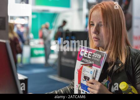 KYIV, UKRAINE - APRIL 06, 2019: People visit CEE 2019, the largest electronics trade show of Ukraine in Tetra Pack EC. Stock Photo