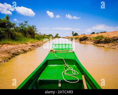 Exploring Tonle Sap lake and its channels with typical long tail boat, Siem Reap Province, Cambodia Stock Photo