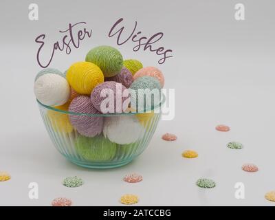 Bowl of Easter Egg Decor and Little Mint White Chocolate Candies with White Spots and Words to Say Easter Wishes in a Cursive Purple Font with a White Stock Photo