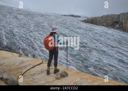Trekker in front of Ritacuba Blanca and its massive glacier, El Cocuy National Park, Boyaca, Colombia Stock Photo