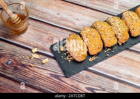 Delicious and tasty Greek  honey cookies with Walnuts called melomakarona , traditionally enjoyed during Christmas. Stock Photo