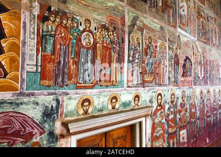 Walls covered in Byzantine icons. The Holy and Great Monastery of Vatopedi – an Eastern Orthodox monastery on Mount Athos, Greece. Stock Photo