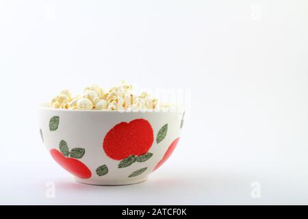 popcorn in bowl on white background..popcorn is snack