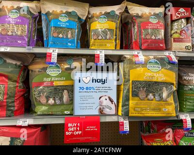 Orlando, FL/USA-1/29/20: A display of hay which is food for rabbits, gunea pigs or chinchillas at a Petsmart Superstore ready for pet owners to purcha Stock Photo