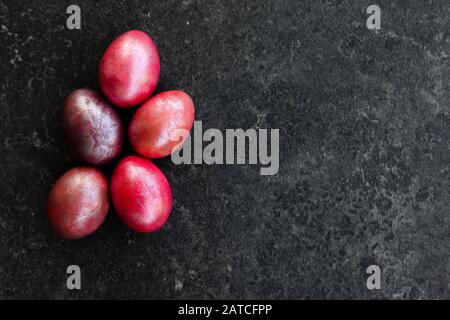 Marbled Easter eggs on black plate Stock Photo