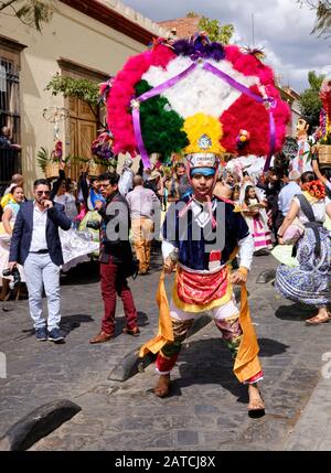 Man dancing Dance of the Feather in Zapotec warrior outfit Part of  Traditional wedding parade (Calenda de Bodas) on the streets of Oaxaca  Stock Photo - Alamy