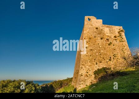 Torre Montepucci, medieval watch tower at Gargano Promontory over Adriatic Sea, near town of Peschici, Apulia, Italy Stock Photo