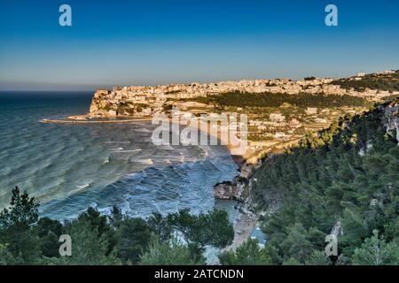 Town of Peschici at Gargano Promontory over Adriatic Sea, view at sunset from road SP89, Apulia, Italy Stock Photo