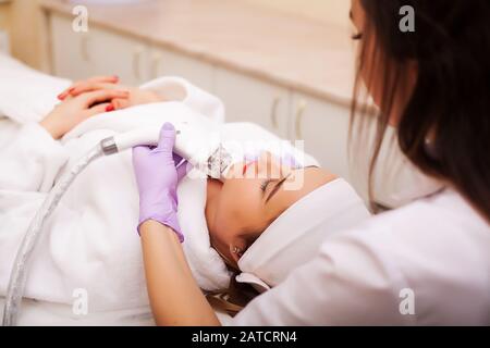 Woman getting LPG hardware massage at the beauty clinic Stock Photo