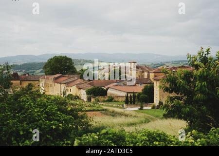 Vineyards, chateau and Bagnols village of pierre dorées - golden stone Rhône, Country,France; Region,Auvergne-Rhône-Alpes; Villefranche-sur-Saône Stock Photo