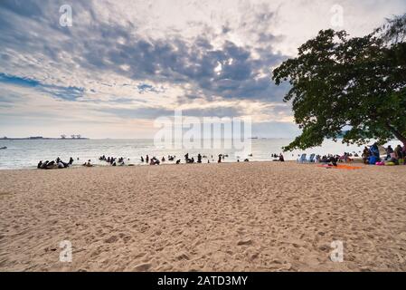 People happy and enjoying picnic under sunny day with family at the beach. Selective focus Stock Photo