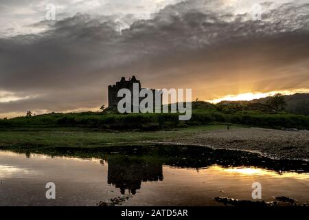 Aerial drone shot of Castle Tioram, it is a ruined castle that sits on the tidal island Eilean Tioram in Loch Moidart, Lochaber, Highland, Scotland. I Stock Photo