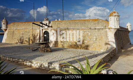 Lagos, Portugal - May 12, 2017: Fort of Ponta da Bandeira, aka Fort of Our Lady of Penha de Franca, or simply Lagos Fortress. Built around 1690, the fort was restored in the 1960’s and today the interior is open to the public Stock Photo