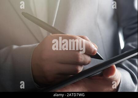 Making online deal theme. Business man sign electronic document Stock Photo