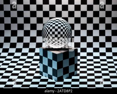Glass sphere on a cube on a checked background Stock Photo