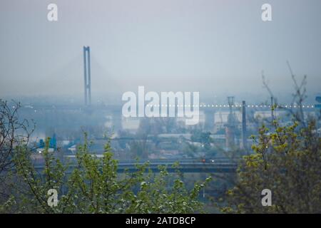 A view of Kyiv, at sunrise, with the bridge over the Dnipro River Stock Photo