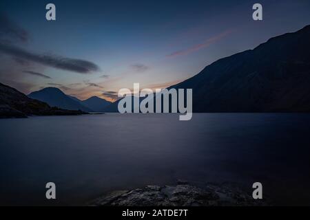 Sunrise over Wast Water a lake located in Wasdale, a valley in the western part of the Lake District National Park, England, it is the deepest lake in Stock Photo