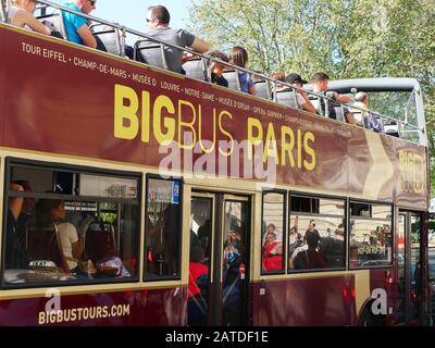 Paris, France - April 2019: city sightseeing double decker touristic bus in downtown