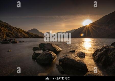 Sunrise over Wast Water a lake located in Wasdale, a valley in the western part of the Lake District National Park, England, it is the deepest lake in Stock Photo